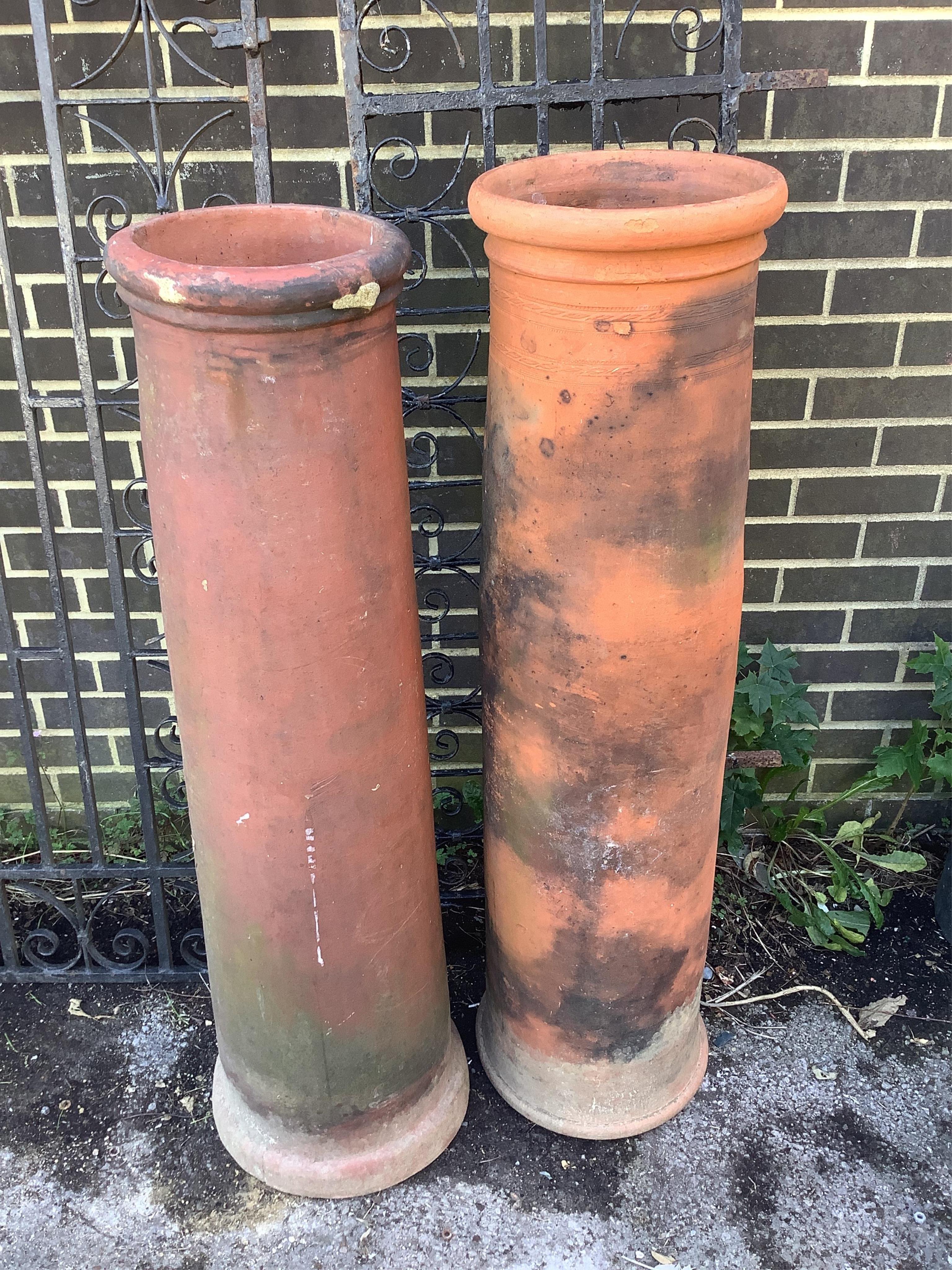 Two terracotta chimney pots, larger 122cm high. Condition - fair